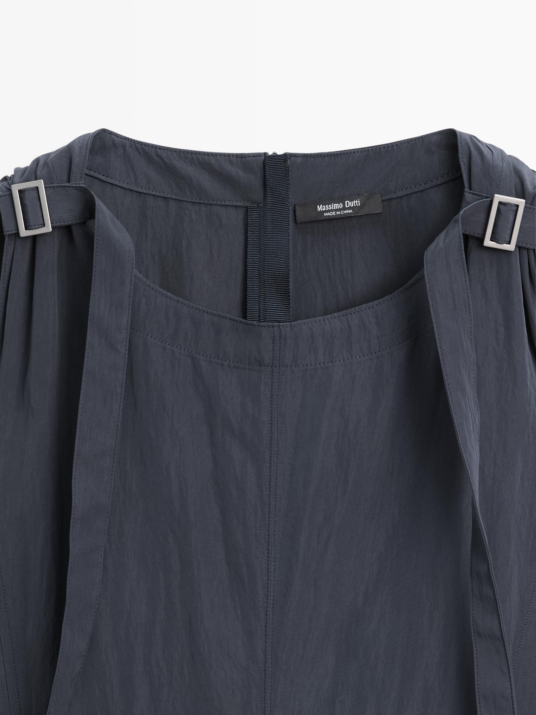Flowing midi dress with buckles